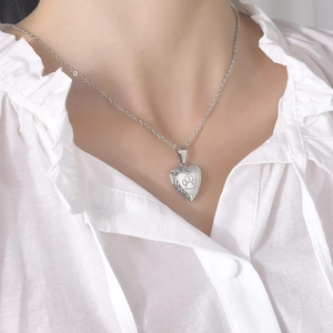 Silver stainless steel heart locket necklace with paw print engraving and scroll patterns