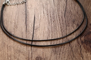 Detail of black wax rope necklace chain with silver lobster clasp and extension link