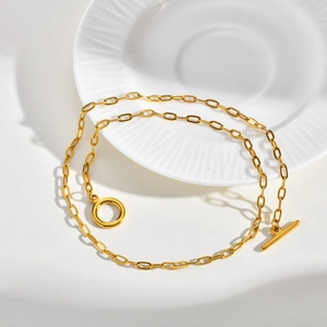 Detail of golden stainless steel chain necklace with classic OT toggle clasp design