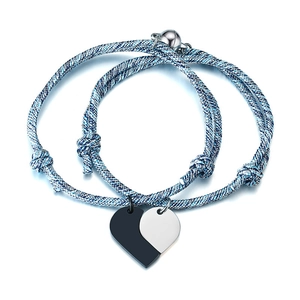 Blue and silver braided couple bracelets with magnetic heart puzzle pendants