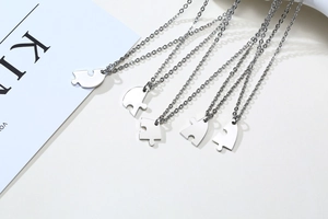 Detail of 5-piece stainless steel heart puzzle necklace set for friendship and family