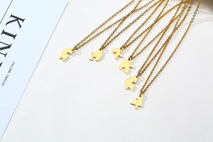 Detailed view of six interlocking gold puzzle piece heart necklaces for friendship