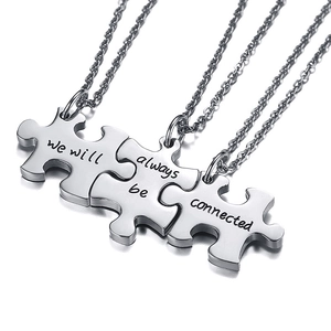 Detail of silver stainless steel puzzle necklaces with we will always be connected engraving