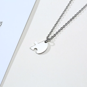 Modern polished stainless steel heart puzzle piece pendant necklace on cross chain