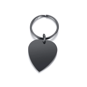 Macro shot of guitar pick keychain in black polished stainless steel with mirror finish