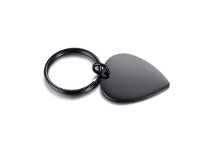 Close-up of matte black stainless steel heart pendant on a round keychain ring