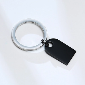 Close-up of polished black rectangle pendant and silver stainless steel keyring attachment