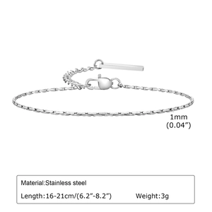 Detail of 1mm thin golden stainless steel hammer chain with polished rectangle tag