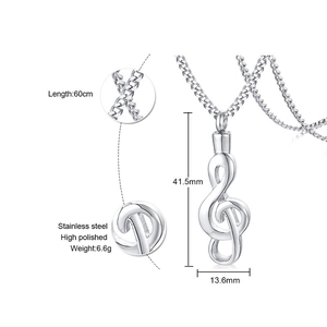 Detail view of musical treble clef urn necklace in polished stainless steel