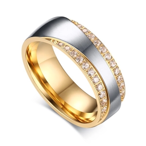 Macro detail of two-tone stainless steel ring with brushed finish and zircon inlay