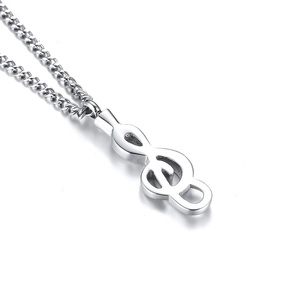 Macro view of polished stainless steel G-clef musical note pendant with cross chain