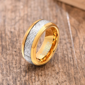 Macro shot of 8mm tungsten carbide ring with gold edges and silver textured inlay
