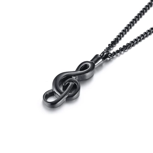 Macro detail of black musical note urn pendant with secure screw cap for ashes