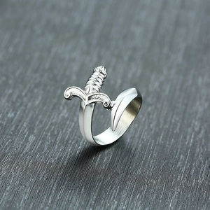 Macro shot of stainless steel dagger ring with vintage engraved hilt and smooth blade