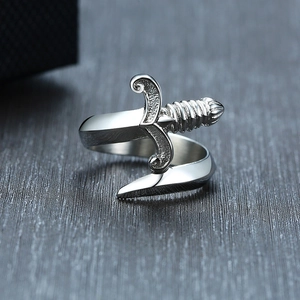 Macro view of curved dagger ring detail with vintage finish and engraved spiral textures