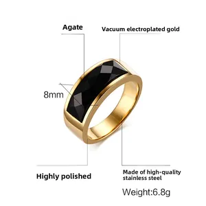 Detailed view of 8mm wide gold stainless steel ring featuring a black faceted onyx stone