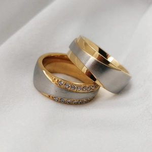 Two-tone stainless steel couples rings with brushed finish and micro-inlaid cubic zirconia