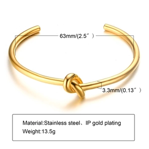 Minimalist knot-style open bangle in gold-plated stainless steel with 63mm inner diameter