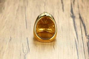Detailed view of the textured hollow back of a gold-plated Egyptian pharaoh ring