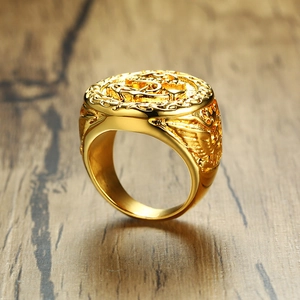 Macro detail of gold stainless steel anchor signet ring with eagle and shield carving