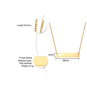 Golden stainless steel necklace with rectangular bar pendant and cutout heart detail