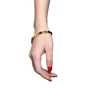 6mm gold-plated stainless steel C-shaped open bangle shown on wrist with mirror finish