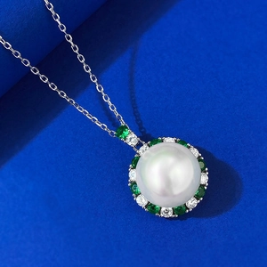 Classic 12mm white pearl necklace with green emerald pendant and silver O-chain link