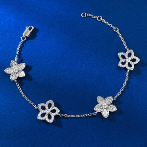 Elegant S925 silver hollow flower bracelet with sparkling cubic zirconia on blue texture