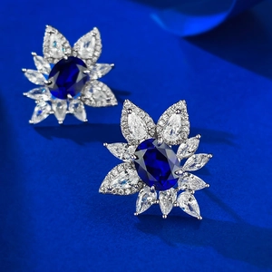 Elegant S925 sterling silver flower stud earrings with oval blue sapphire and clear crystals