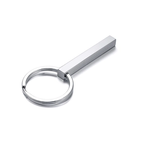 Macro detail of polished stainless steel rectangular pendant keychain with silver finish