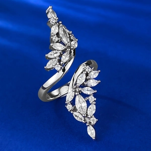 S925 sterling silver open ring with marquise cut zirconia wings on blue background