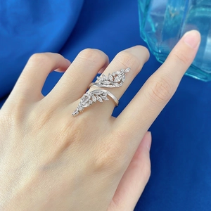 Detail of S925 silver leaf ring with marquise cut stones on a model's hand