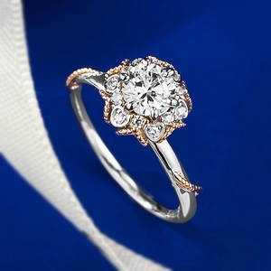 Close-up of two-tone sterling silver ring with halo set round cut sparkling gemstone