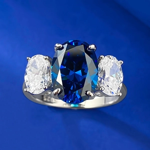 Royal blue oval sapphire three-stone engagement ring with silver S925 band