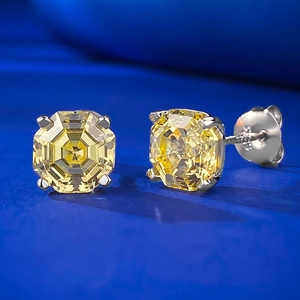 Macro view of S925 silver stud earrings featuring octagonal yellow carbon diamond stones