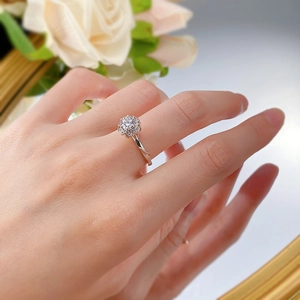 Detailed view of 925 silver ring with flower petal cluster and twisted rope band