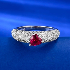 S925 sterling silver ring with heart-cut red gemstone and pavé diamonds on blue silk