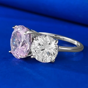 Minimalist silver ring with oval pink carbon diamond and round white crystal in 4-prong setting