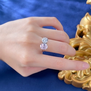 Close-up of Toi et Moi ring featuring oval pink and round white high carbon diamonds