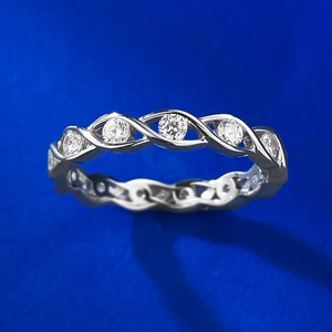 Elegant S925 sterling silver intertwined wave ring featuring sparkling cubic zirconia stones