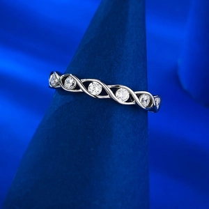 Macro shot of silver S925 ring with intertwined vine design and sparkling zircon stones