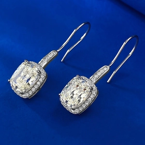 Macro detail of cushion cut halo earrings in S925 silver with sparkling high carbon diamonds