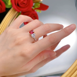 Close-up of S925 silver ring featuring rectangular ruby and heart-shaped diamond stones