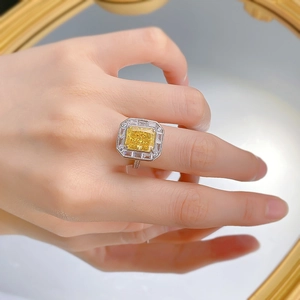 925 silver cocktail ring featuring a 4-carat yellow radiant-cut gemstone on a model hand
