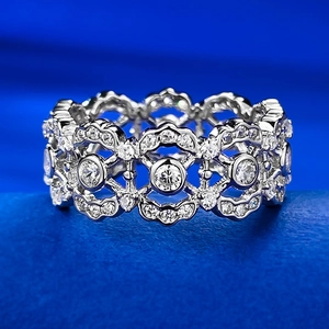 Lace hollow floral 925 silver ring with sparkling diamonds on blue silk background