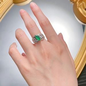 Elegant S925 silver ring featuring marquise emerald and feathered diamond leaf design