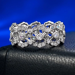 Macro detail of 925 silver hollow lace ring with zircon inlay on leather display