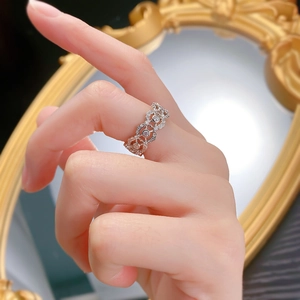 Macro view of vintage lace-style 925 silver hollow ring with micro-set zircon stones