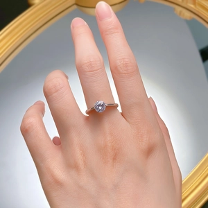 Close-up of 925 silver ring with a sparkling one-carat round cut solitaire gemstone