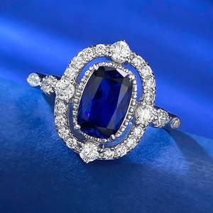Macro shot of rectangular blue sapphire stone and S925 silver pave setting on a ring